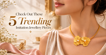 Gold-toned floral imitation necklace featuring three flower-shaped pendants, styled with a cream satin outfit. 